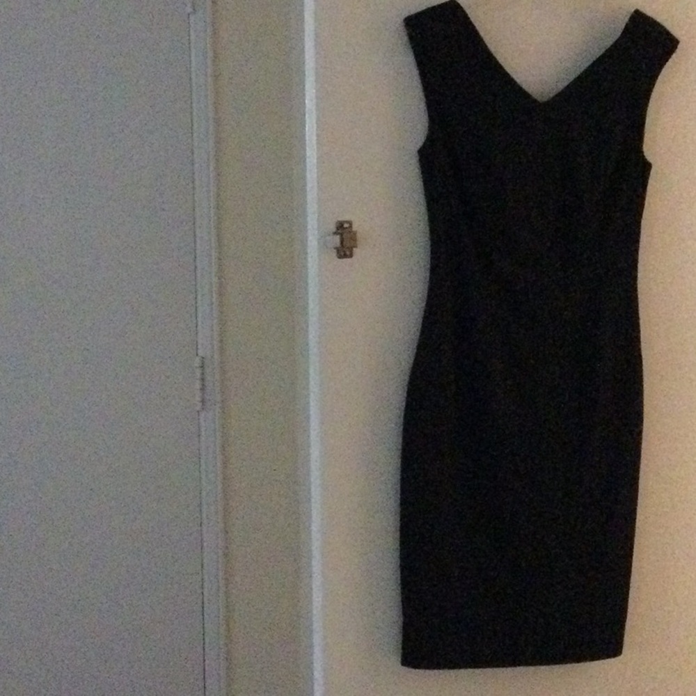 Black cocktail dress. V neck line Front and back neck